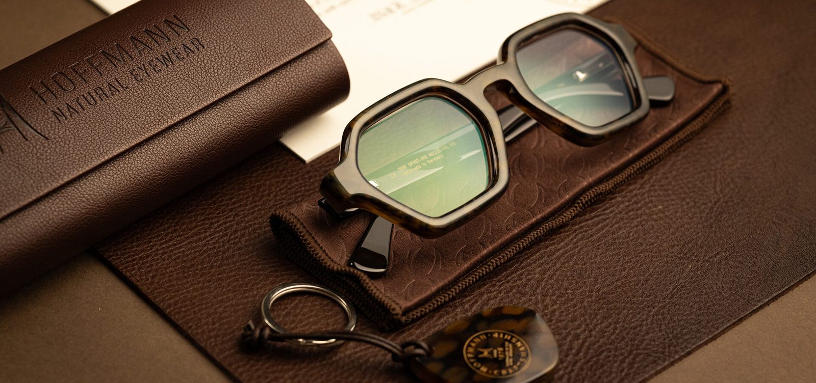 A Hoffmann frame on its leather pouch beside the case